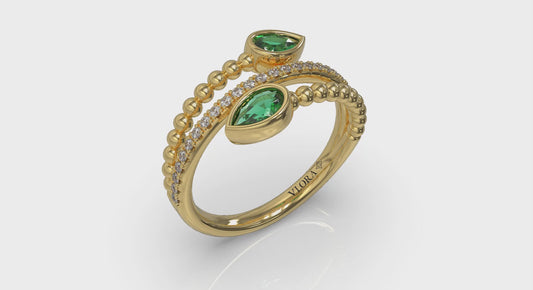 Bezel Set Pear shaped Emerald and Diamond Wrap Ring